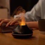 Newest Rgb Flame Aroma Diffuser 130ML 3D Colorful Humidifier Fire Volcano. Fixed Price $27.99.