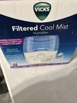 Vicks Filtered Cool Mist Humidifier, Medium Room, 1.1 Gallon Tank White, Blue. Fixed Price $25.00.